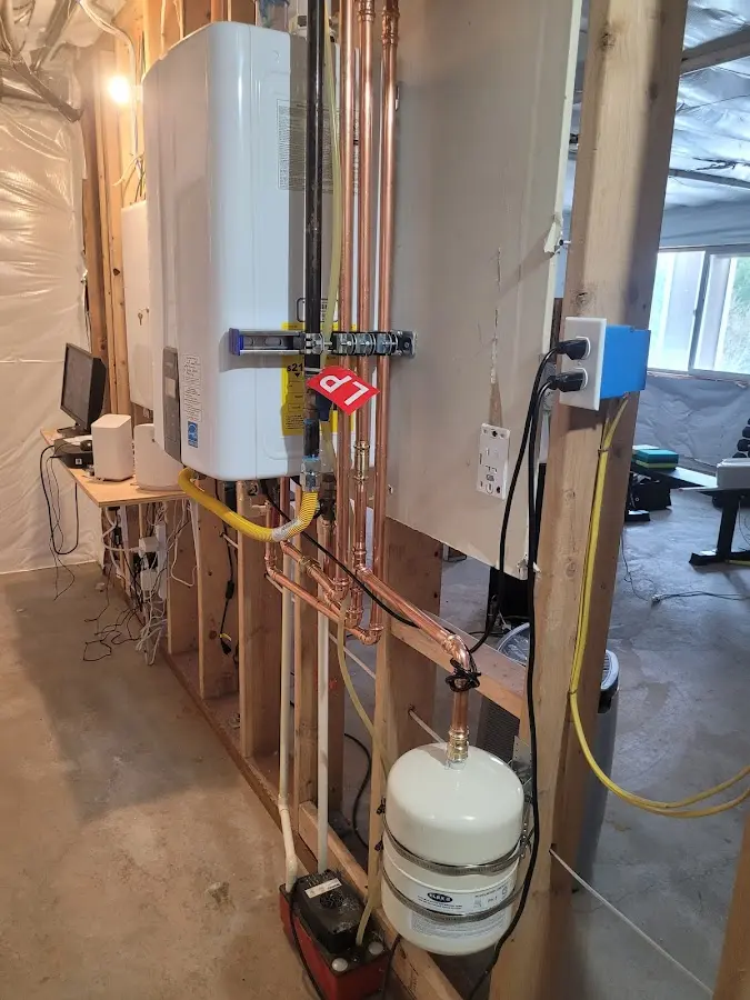 Licensed plumber repairing a kitchen sink in Concord
